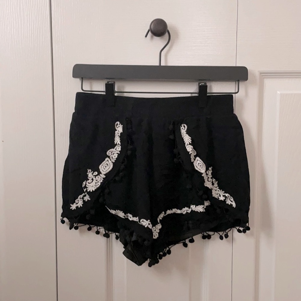 Francesca’s Black Pom Pom Shorts.